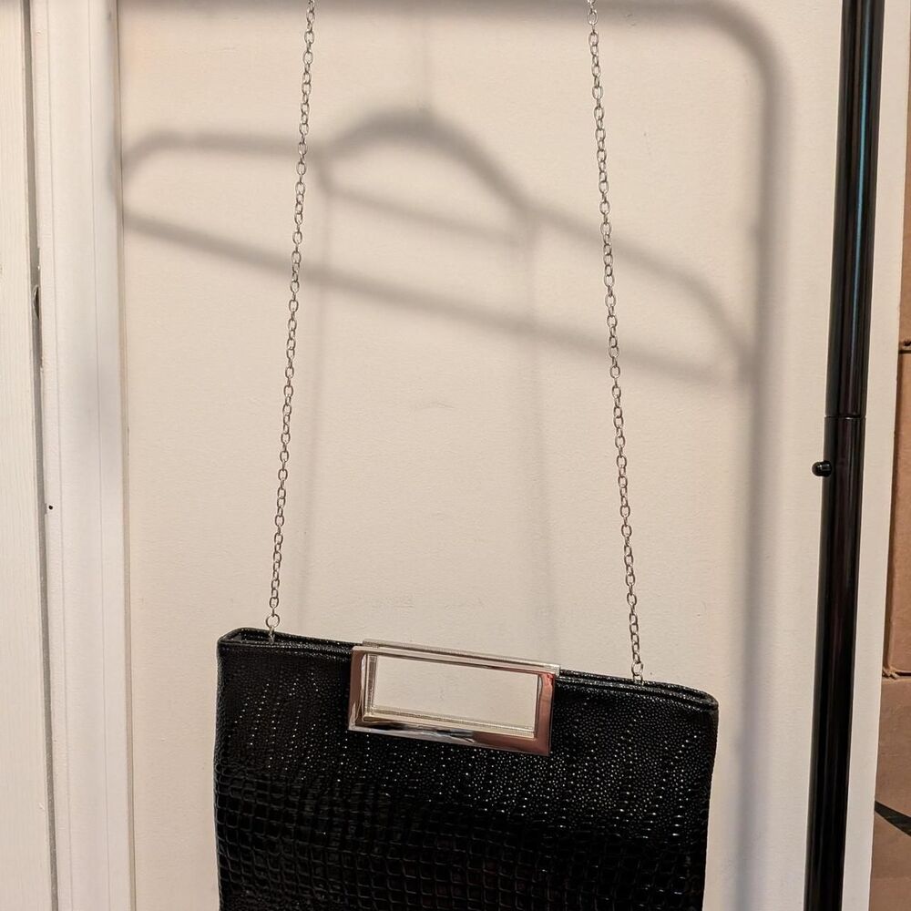 Black crocodile textured clutch with silver chain strap